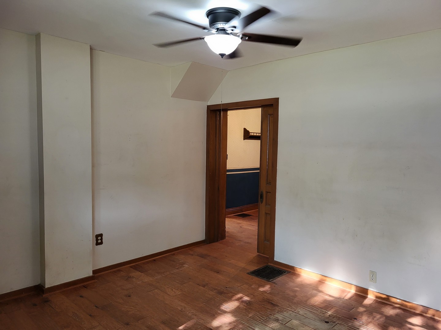 102 South 9th Street Rochelle, IL 61068 - Photo 7 of 13 an empty room with closet and a chandelier fan