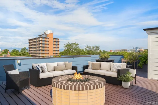 a view of roof deck with patio