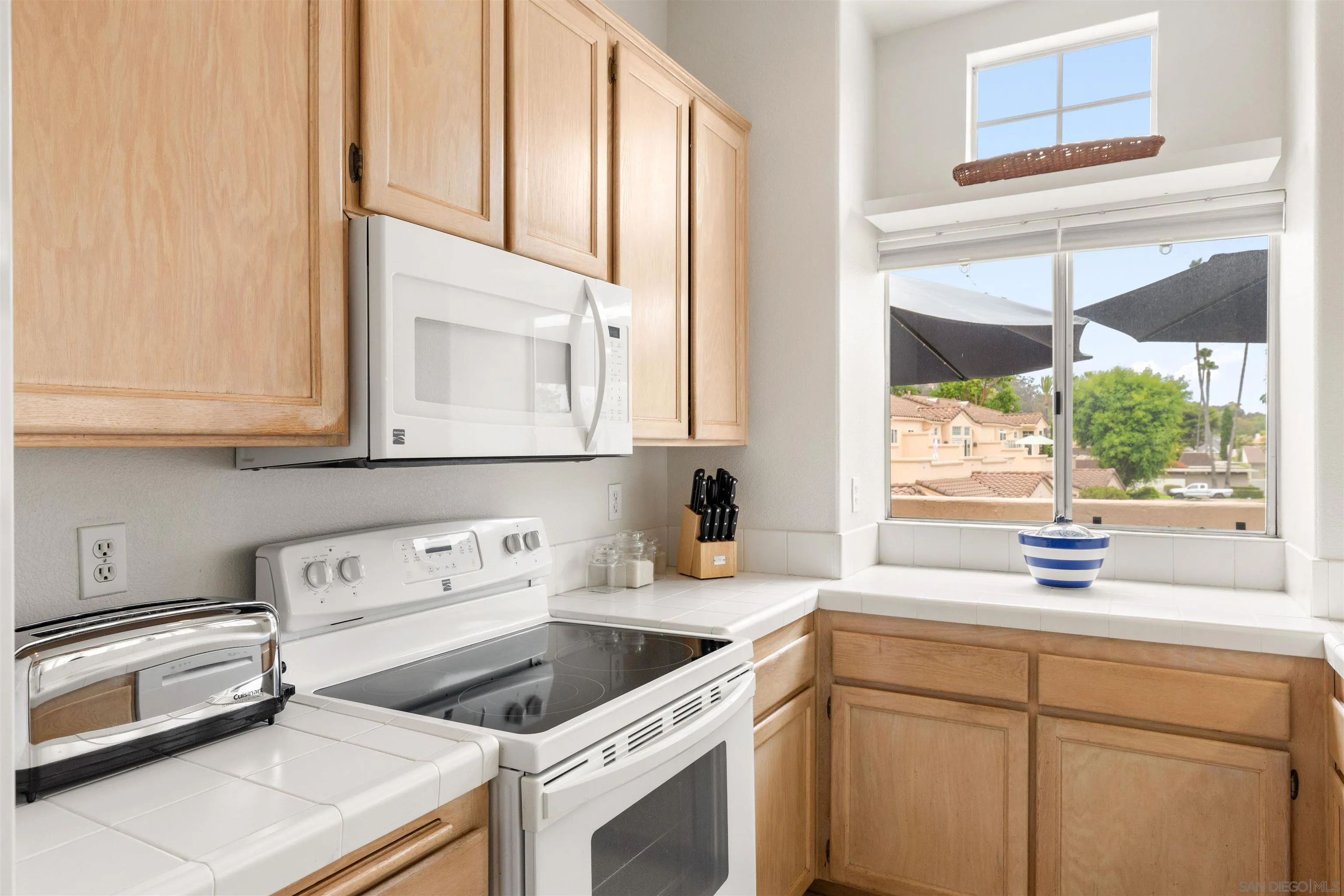 5609 Avenida De Parque Rancho Santa Fe, CA 92091 - Photo 12 of 26 a kitchen with a sink cabinets and window