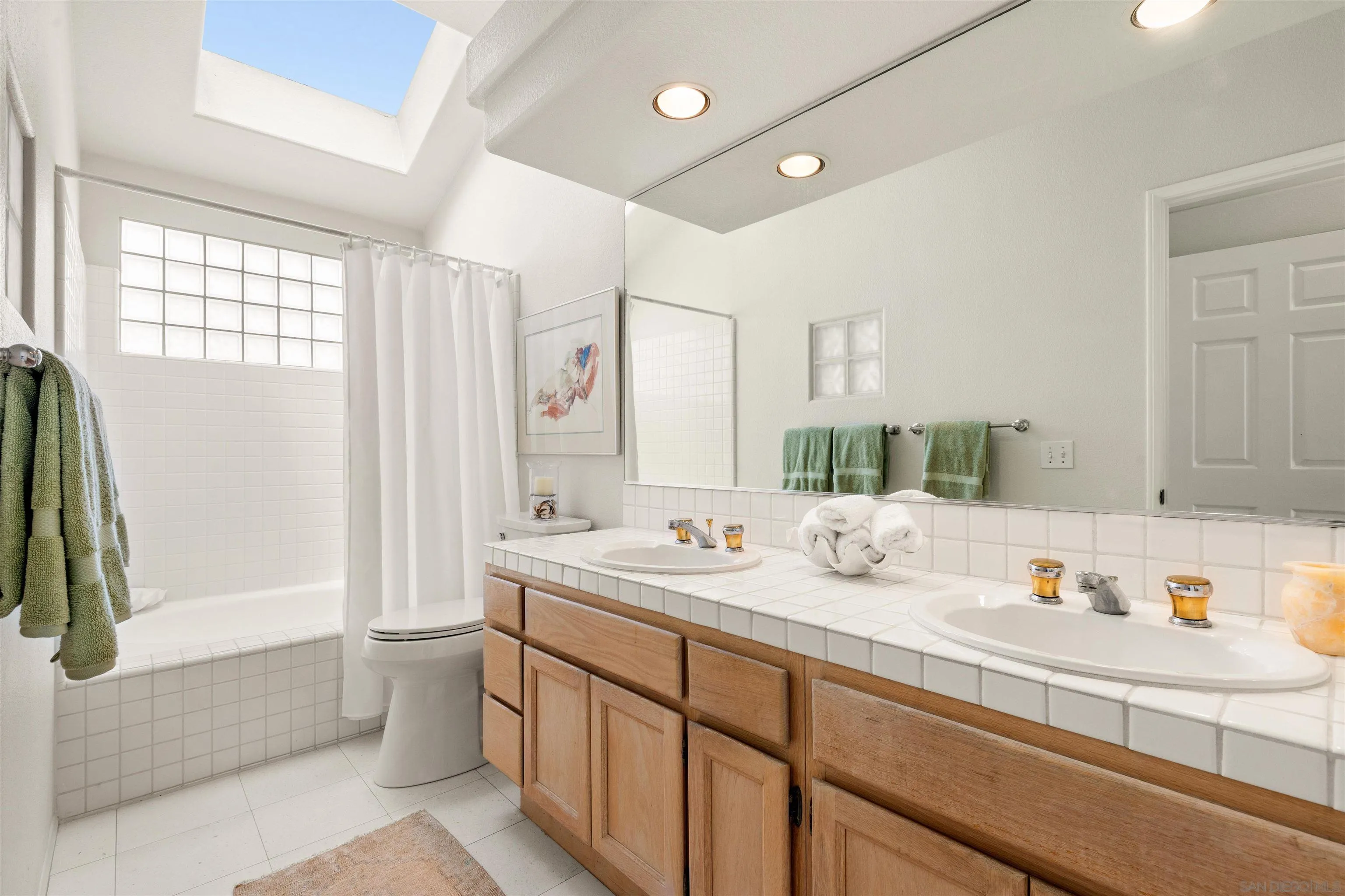 5609 Avenida De Parque Rancho Santa Fe, CA 92091 - Photo 13 of 26 a bathroom with a tub sink and mirror
