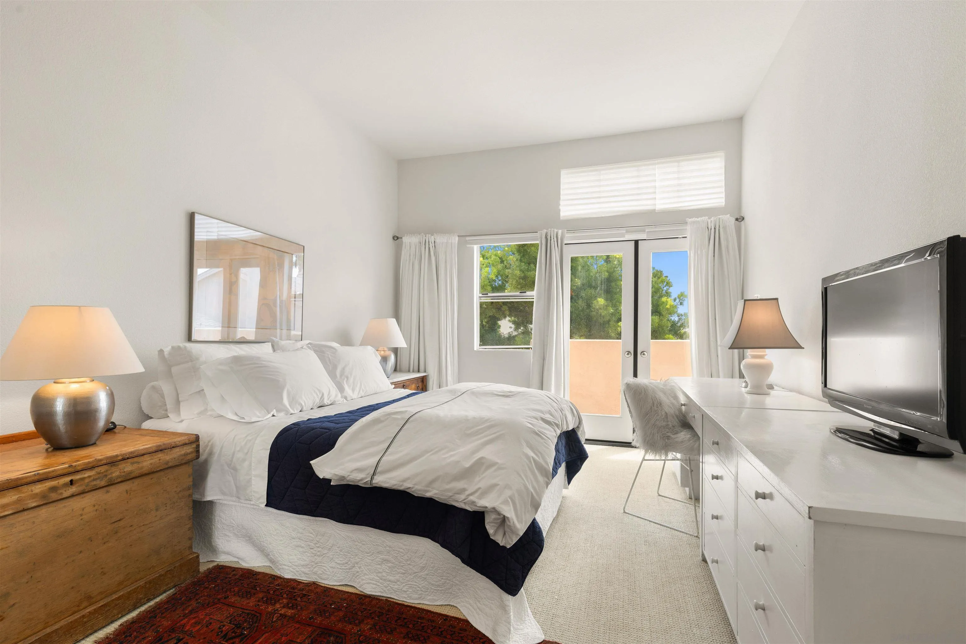 5609 Avenida De Parque Rancho Santa Fe, CA 92091 - Photo 14 of 26 a bedroom with a bed and a flat screen tv