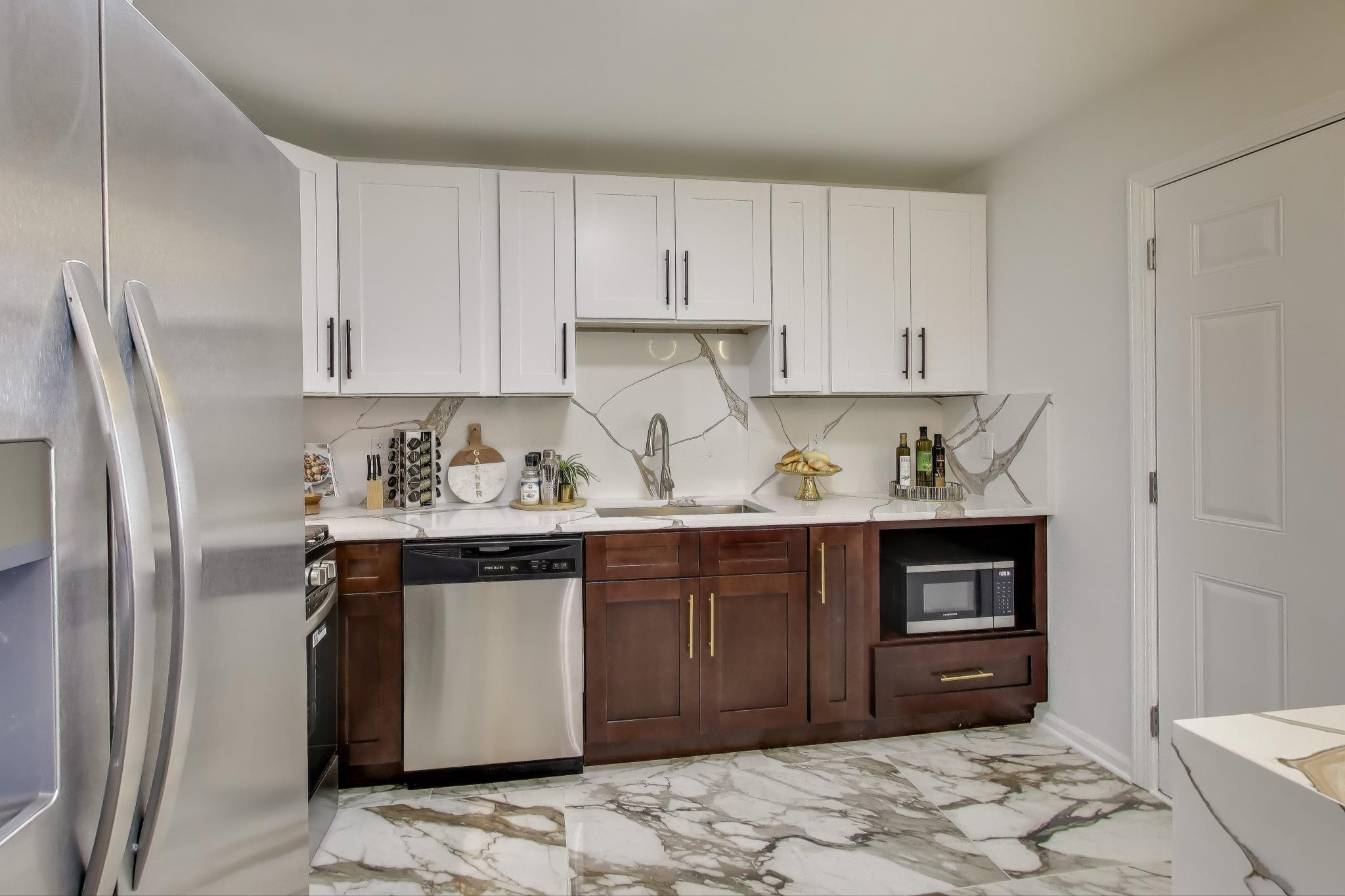 1124 Clinton Street Gary, IN 46406 - Photo 16 of 52 a kitchen with stainless steel appliances granite countertop a refrigerator and a stove