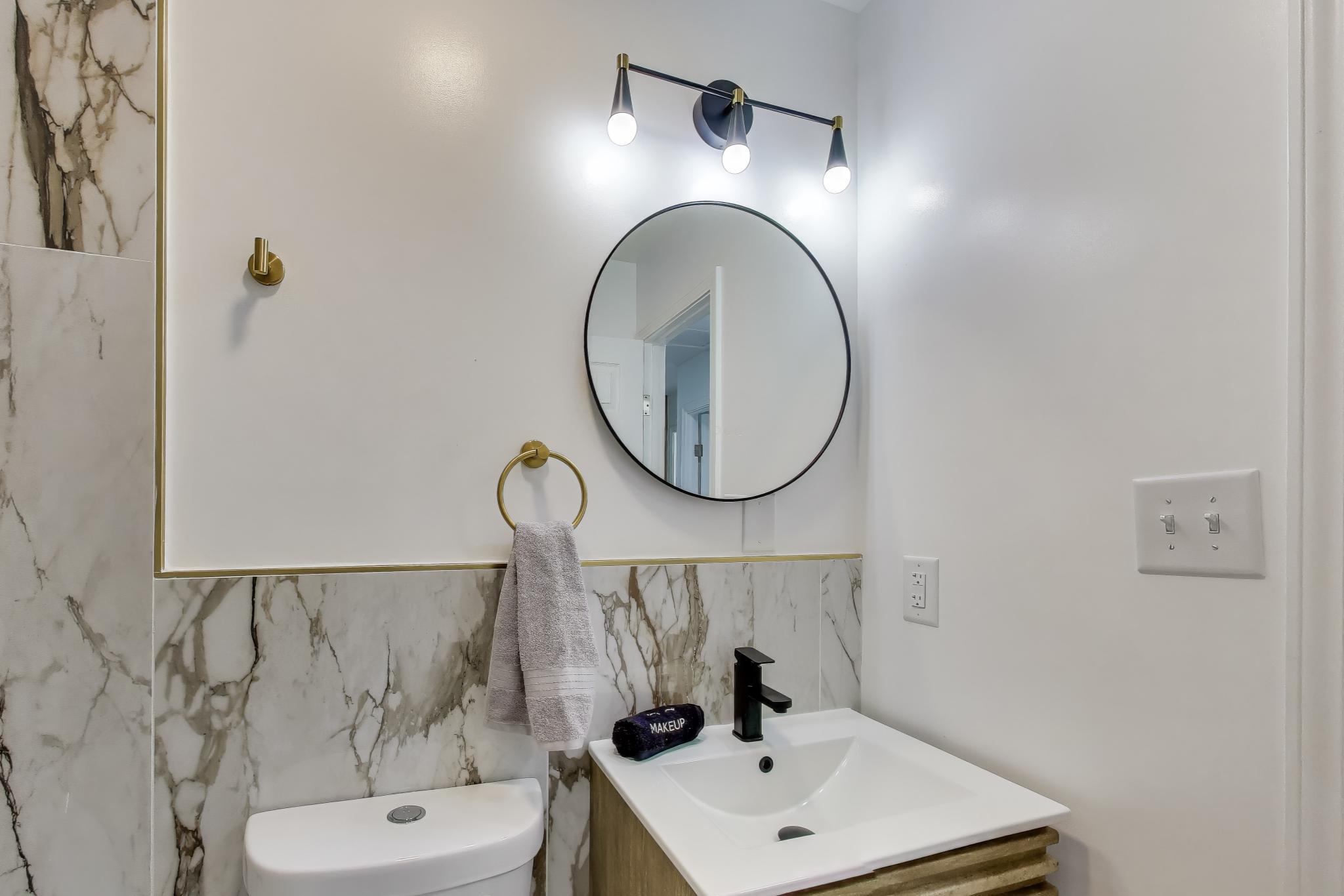 1124 Clinton Street Gary, IN 46406 - Photo 21 of 52 a bathroom with a sink and a mirror