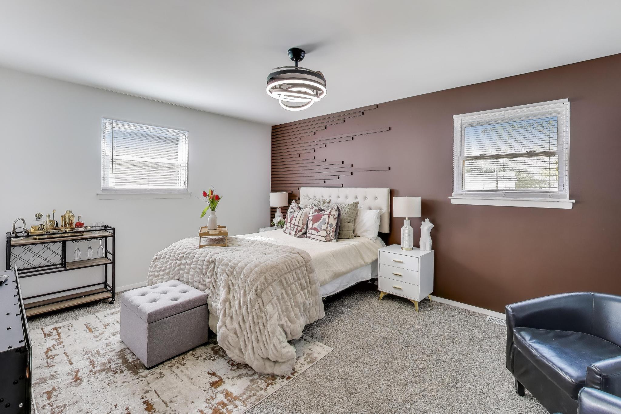 1124 Clinton Street Gary, IN 46406 - Photo 22 of 52 a bedroom with a bed and a couch