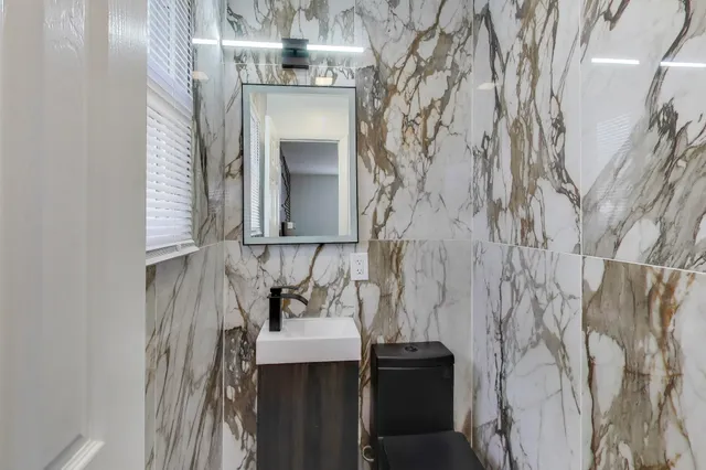 a bedroom with bed and a window