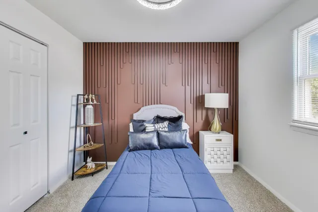 a view of room with furniture and wooden floor