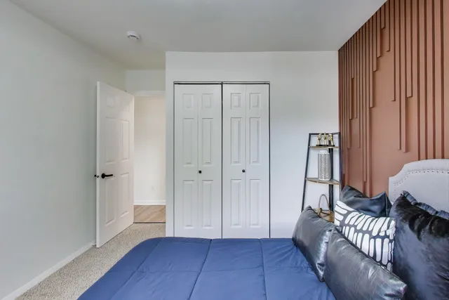 a living room with furniture and a lamp
