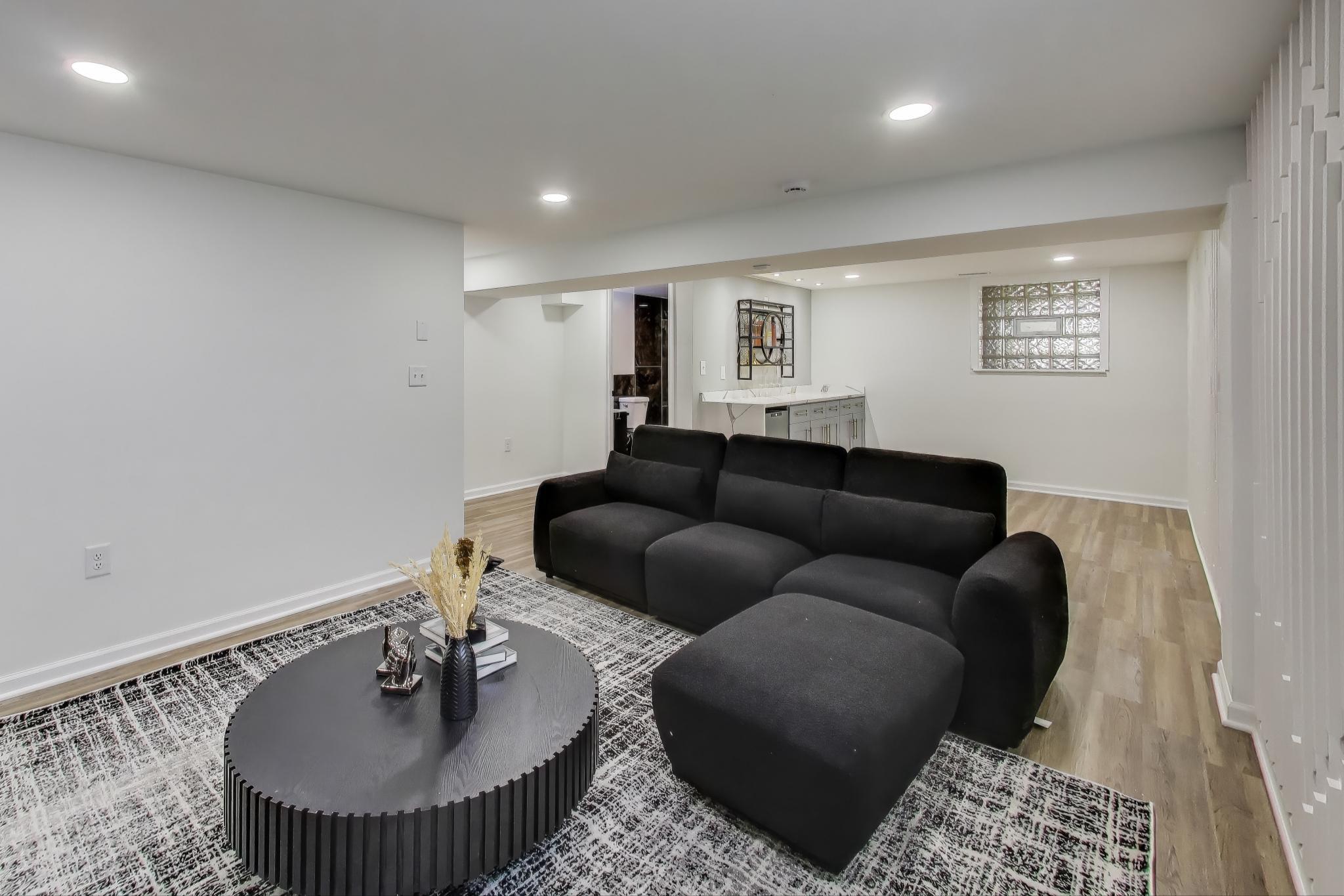 1124 Clinton Street Gary, IN 46406 - Photo 35 of 52 a living room with furniture and a wooden floor