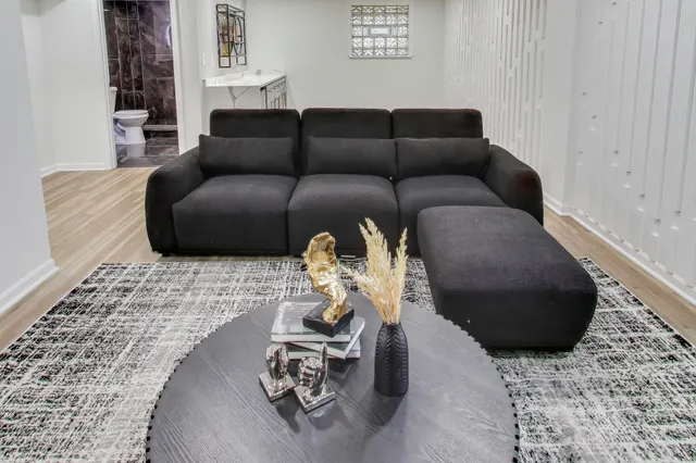 a living room with furniture and a flat screen tv