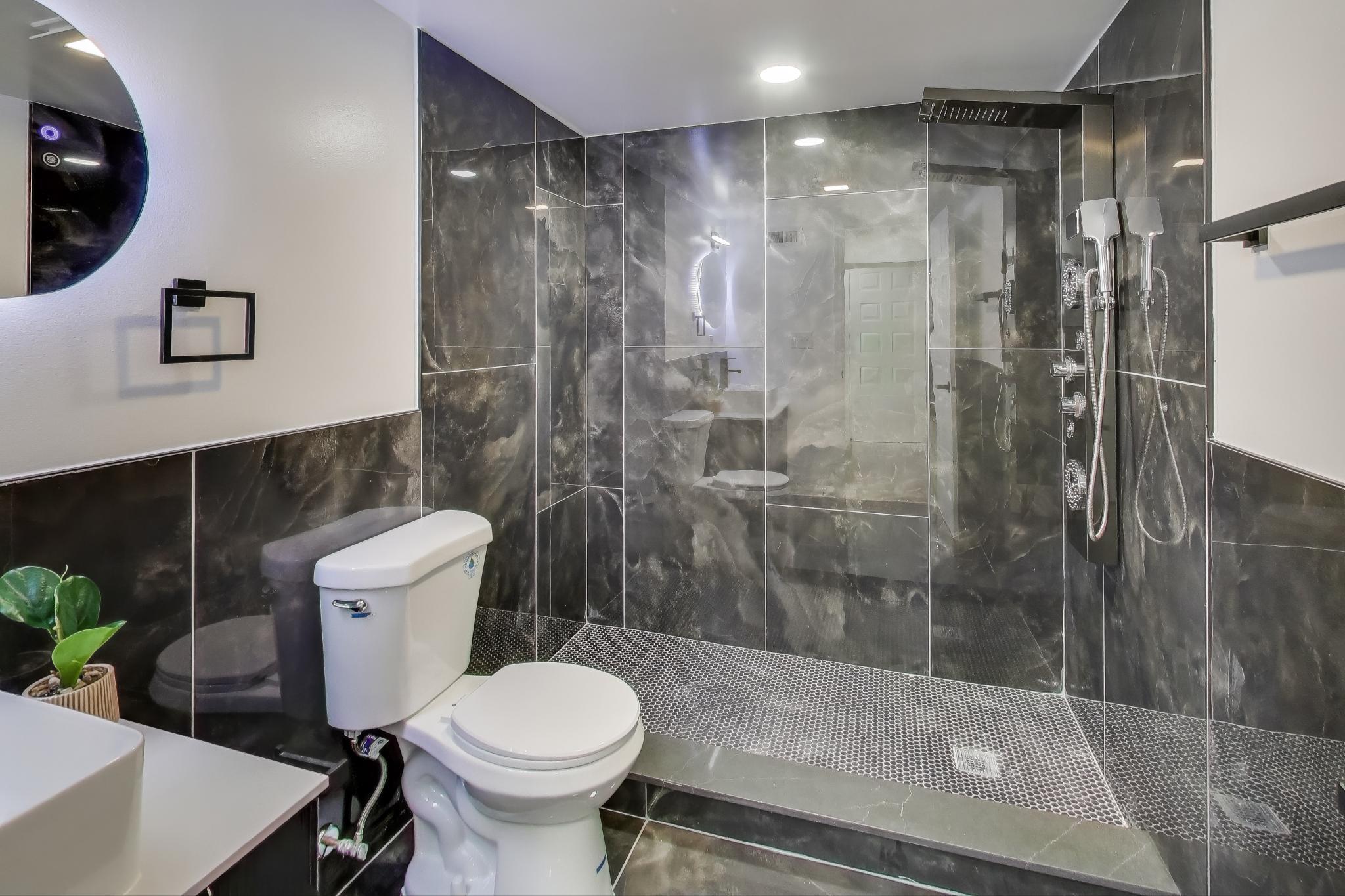 1124 Clinton Street Gary, IN 46406 - Photo 40 of 52 a bathroom with a shower and a toilet