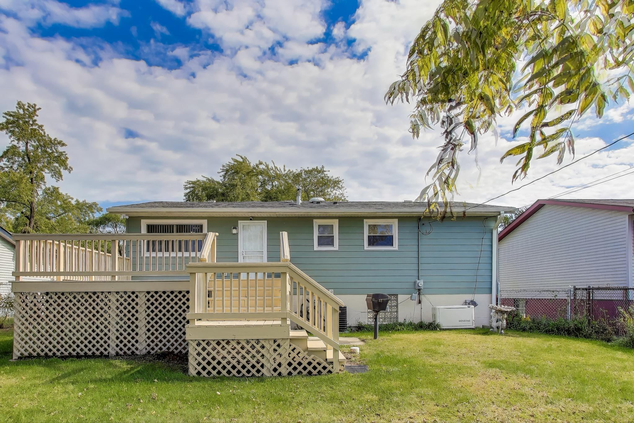 1124 Clinton Street Gary, IN 46406 - Photo 46 of 52 a front view of a house with a garden and yard