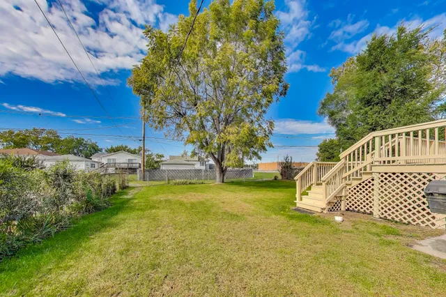 a view of yard with swimming pool