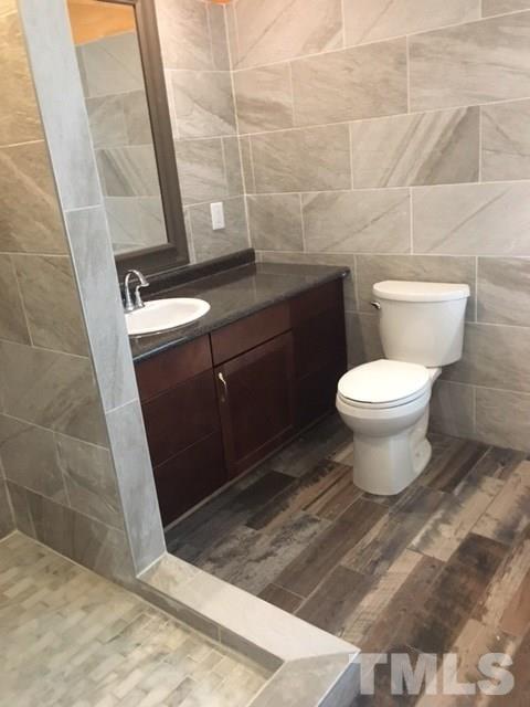 795 Old Durham Road Roxboro, NC 27573 - Photo 5 of 9 a bathroom with a toilet and a sink