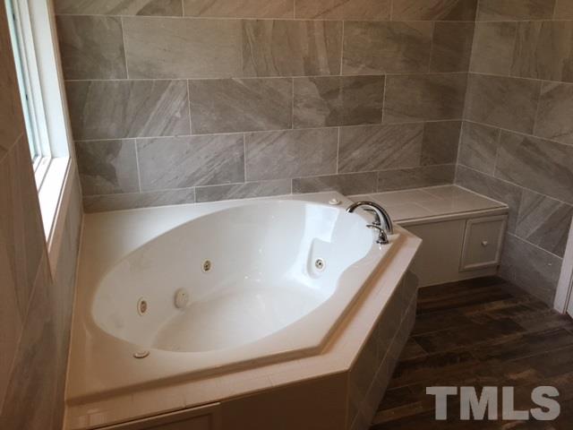 795 Old Durham Road Roxboro, NC 27573 - Photo 6 of 9 a bathroom with a bathtub