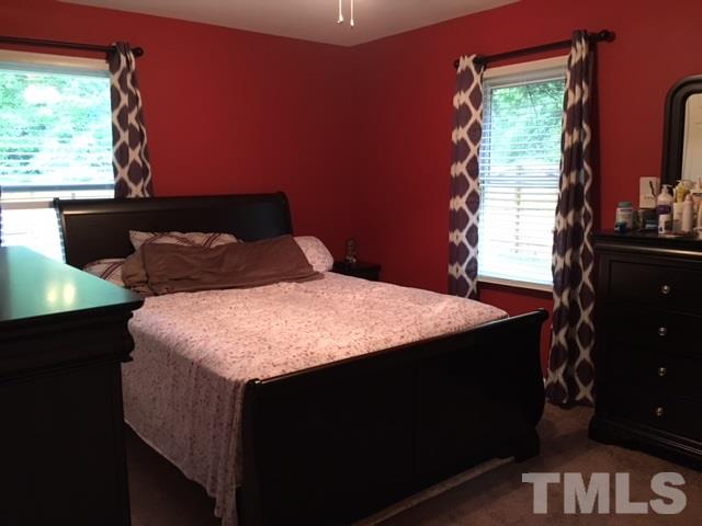 795 Old Durham Road Roxboro, NC 27573 - Photo 7 of 9 a bedroom with a bed and a window