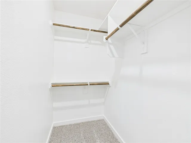 a view of an empty walk in closet