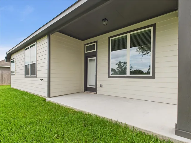a view of front door and yard