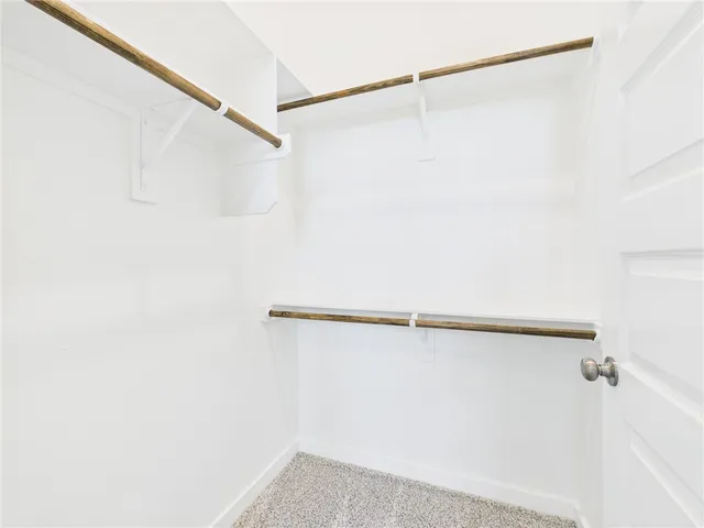 a bathroom with a sink toilet vanity and bathtub
