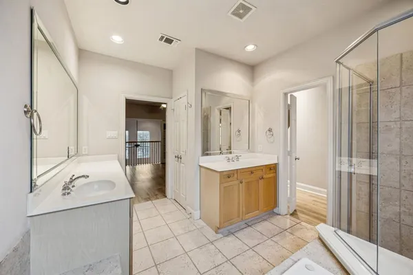 a bathroom with a sink a mirror and a bathtub