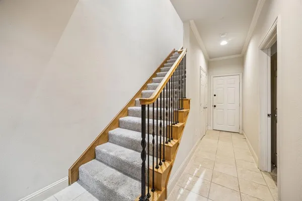 a view of a hallway with staircase