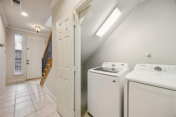a view of storage and utility room with washer and dryer