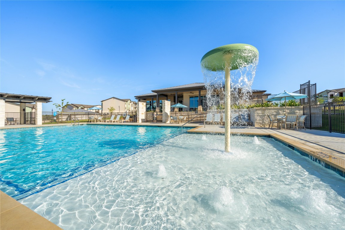 691 Union Chapel Road, Unit A2 Cedar Creek, TX 78612 - Photo 15 of 21 Community pool featuring a patio area and a residential view