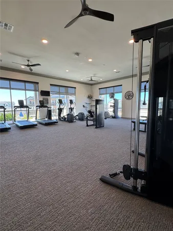 a room with gym equipment and a large window