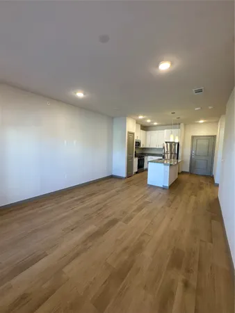 a view of kitchen and a wooden floor
