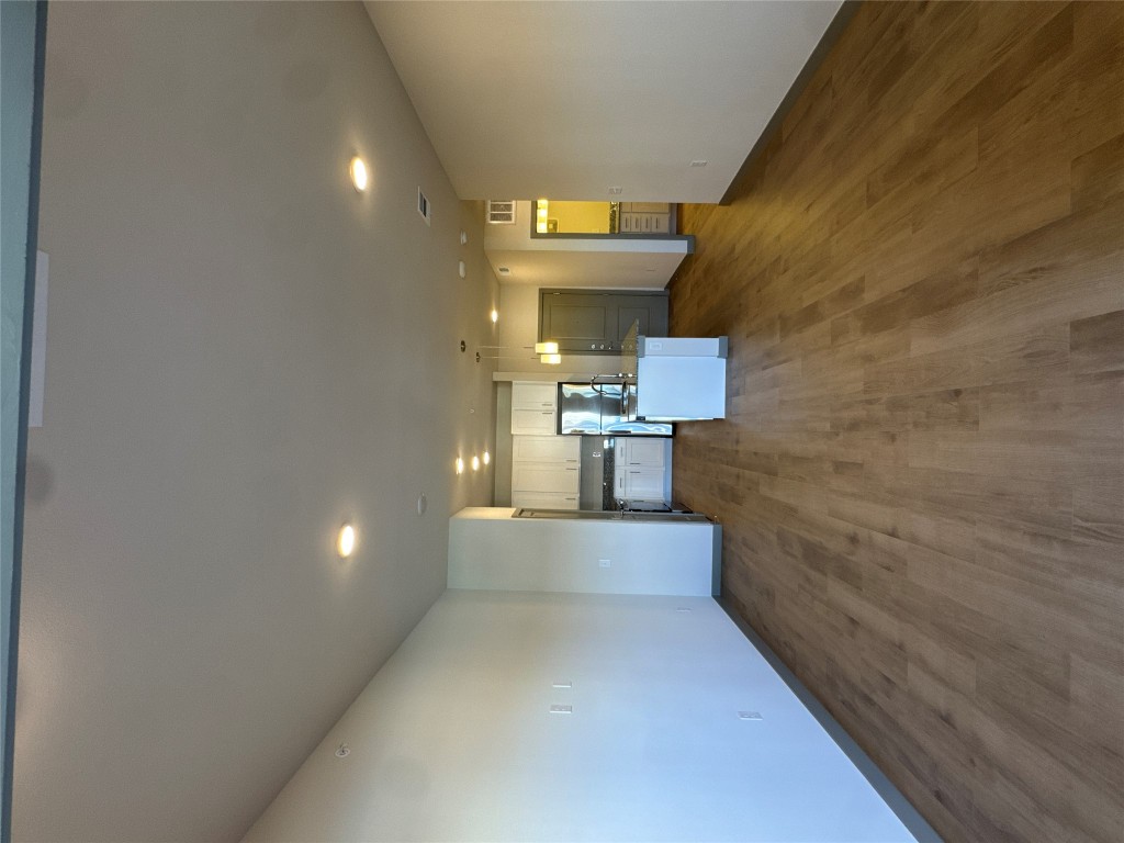 691 Union Chapel Road, Unit A2 Cedar Creek, TX 78612 - Photo 3 of 21 Unfurnished living room featuring recessed lighting and wood-style flooring