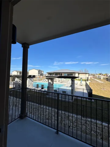 a view of a balcony with an ocean view