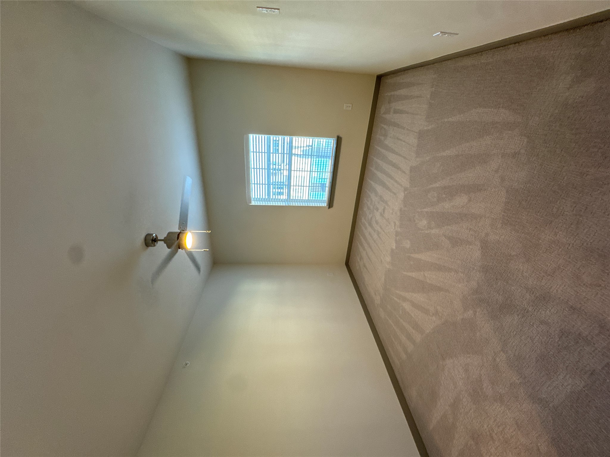 691 Union Chapel Road, Unit A2 Cedar Creek, TX 78612 - Photo 9 of 21 an empty room with a window and a ceiling fan