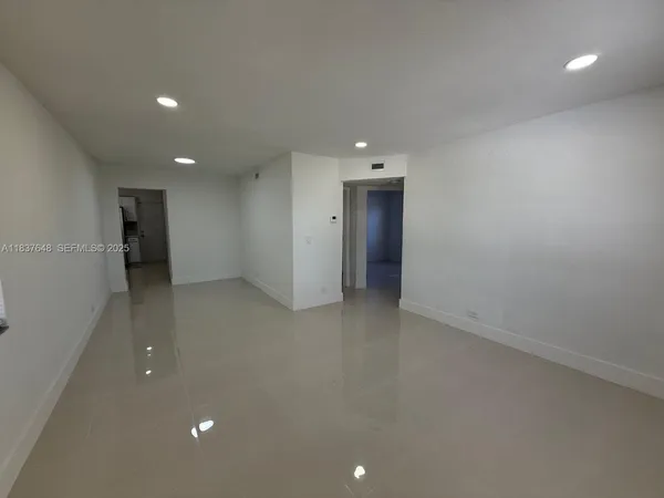 an empty room with a bathroom