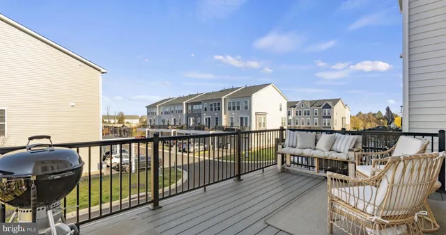 a view of a balcony with furniture