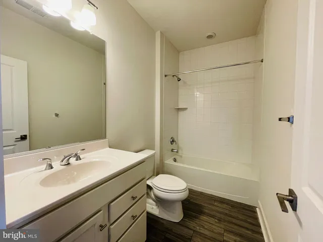 a bathroom with a sink toilet a shower and a mirror