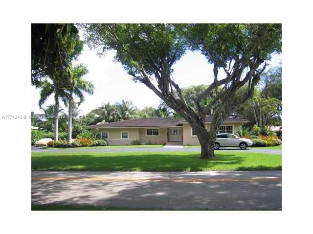 4825 Granada Boulevard Coral Gables, FL 33146 - Photo 1 of 8 a view of house with backyard and tree