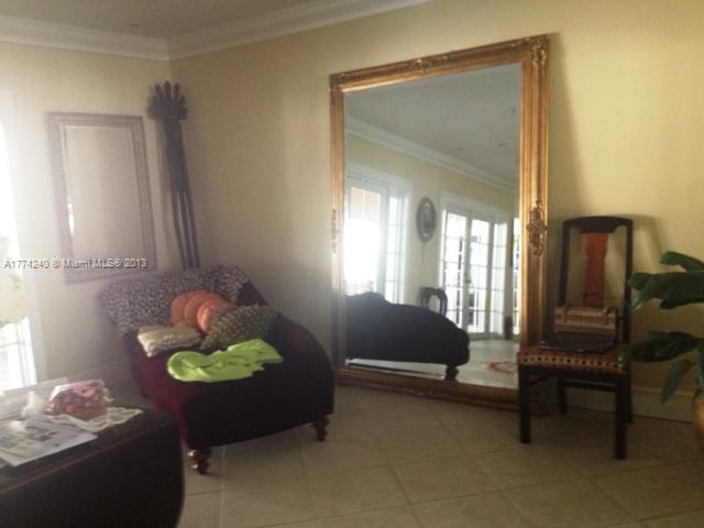 4825 Granada Boulevard Coral Gables, FL 33146 - Photo 2 of 8 a living room with furniture and a window