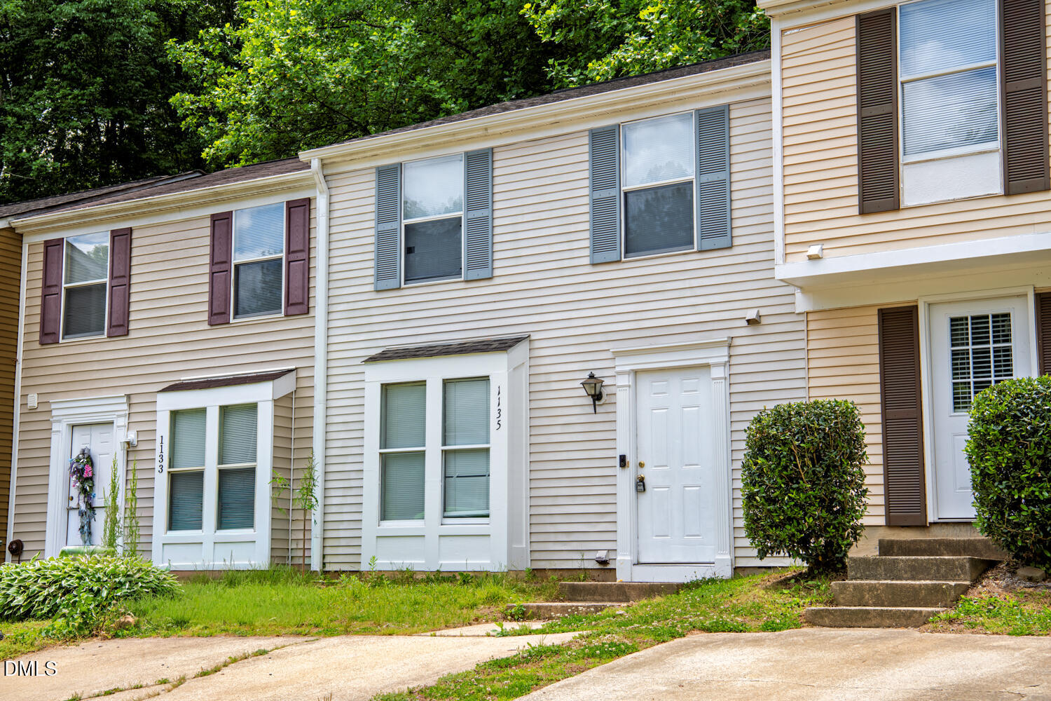 1135 Villa Green Court Raleigh, NC 27612 - Photo 3 of 17 a view of a house with a yard