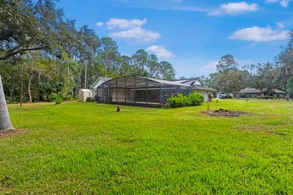 a view of a house with a big yard