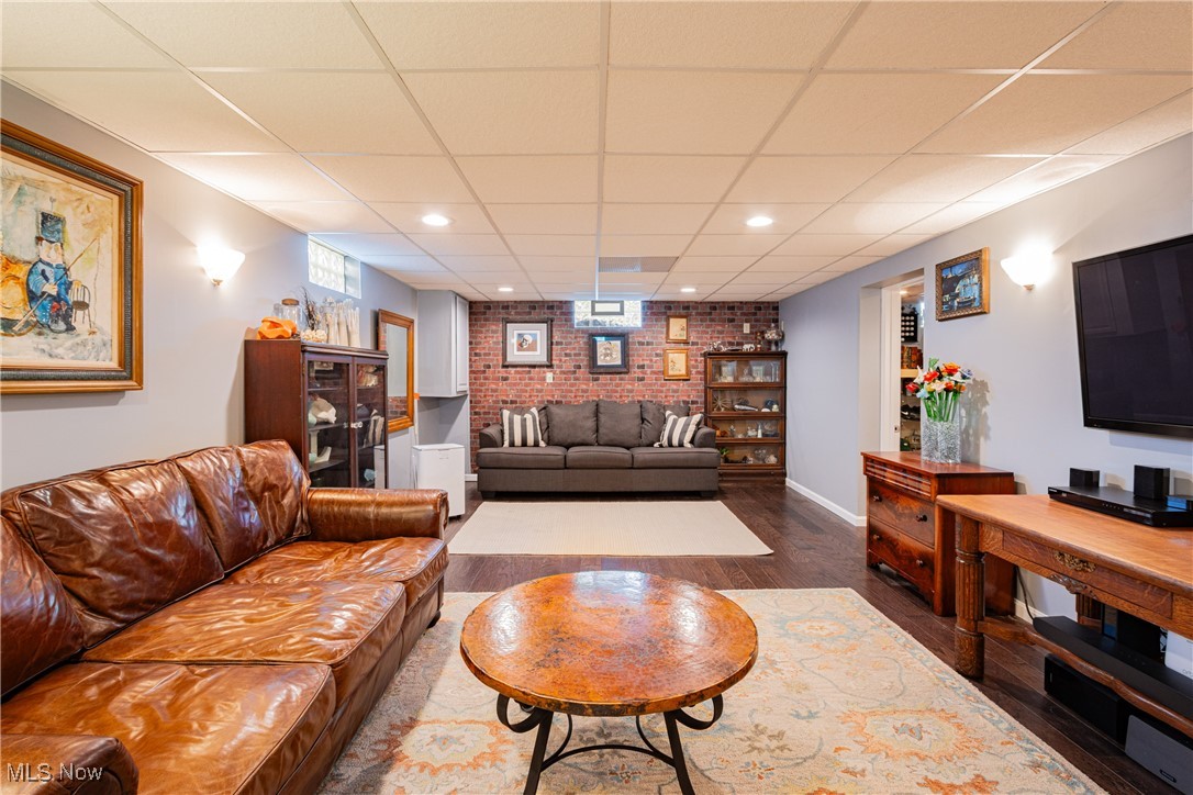 431 Stanley Road Akron, OH 44312 - Photo 17 of 29 Living room featuring dark wood-type flooring and a drop ceiling