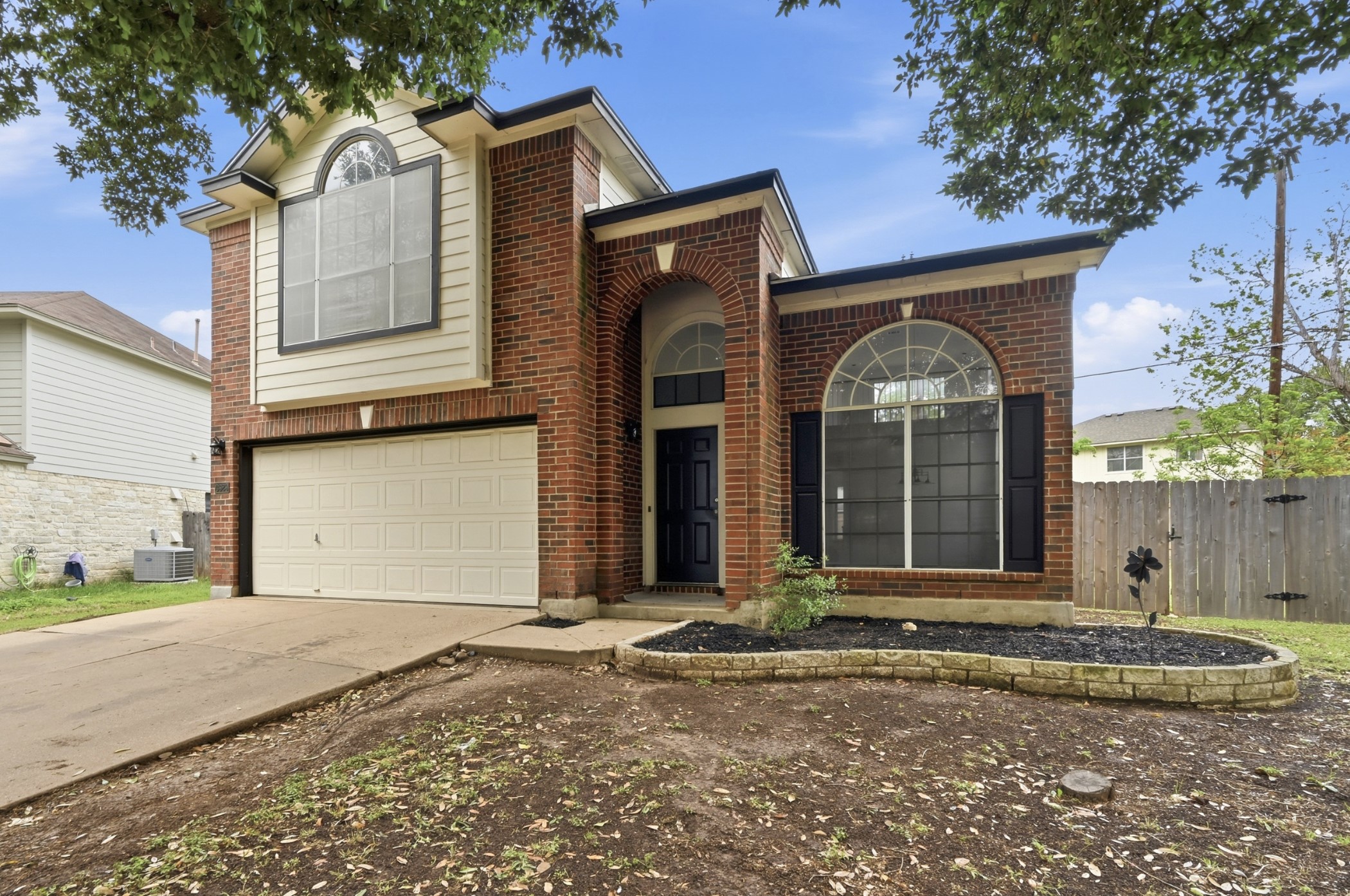 3629 Ruby Red Drive Austin, TX 78728 - Photo 4 of 35 Arched entrance and windows