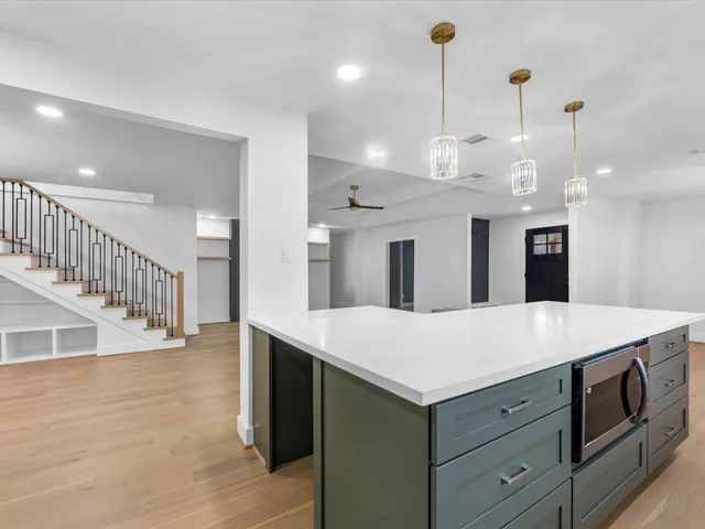 a view of room with window and wooden floor