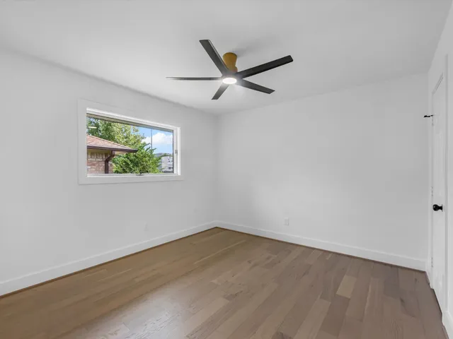 a large kitchen with stainless steel appliances granite countertop a sink and a stove