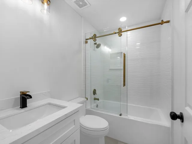 a kitchen with stainless steel appliances granite countertop a stove and a sink