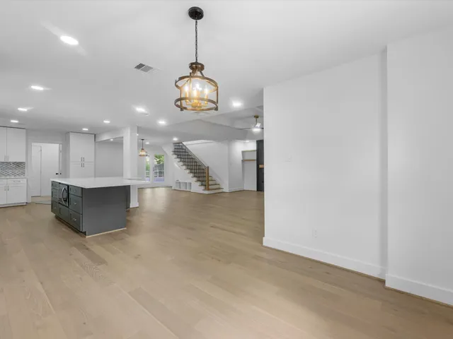 a bathroom with a sink a toilet a mirror and shower