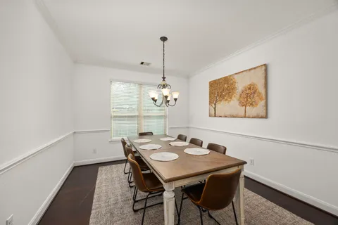 a view of entryway with furniture and wooden floor