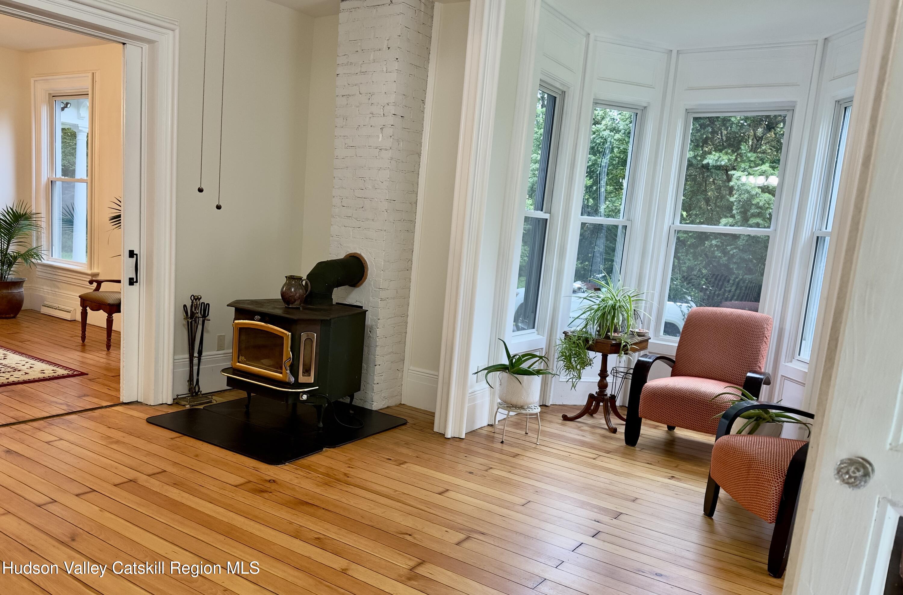472 Lefever Falls Road Rosendale, NY 12401 - Photo 13 of 50 a bedroom with furniture and a large window