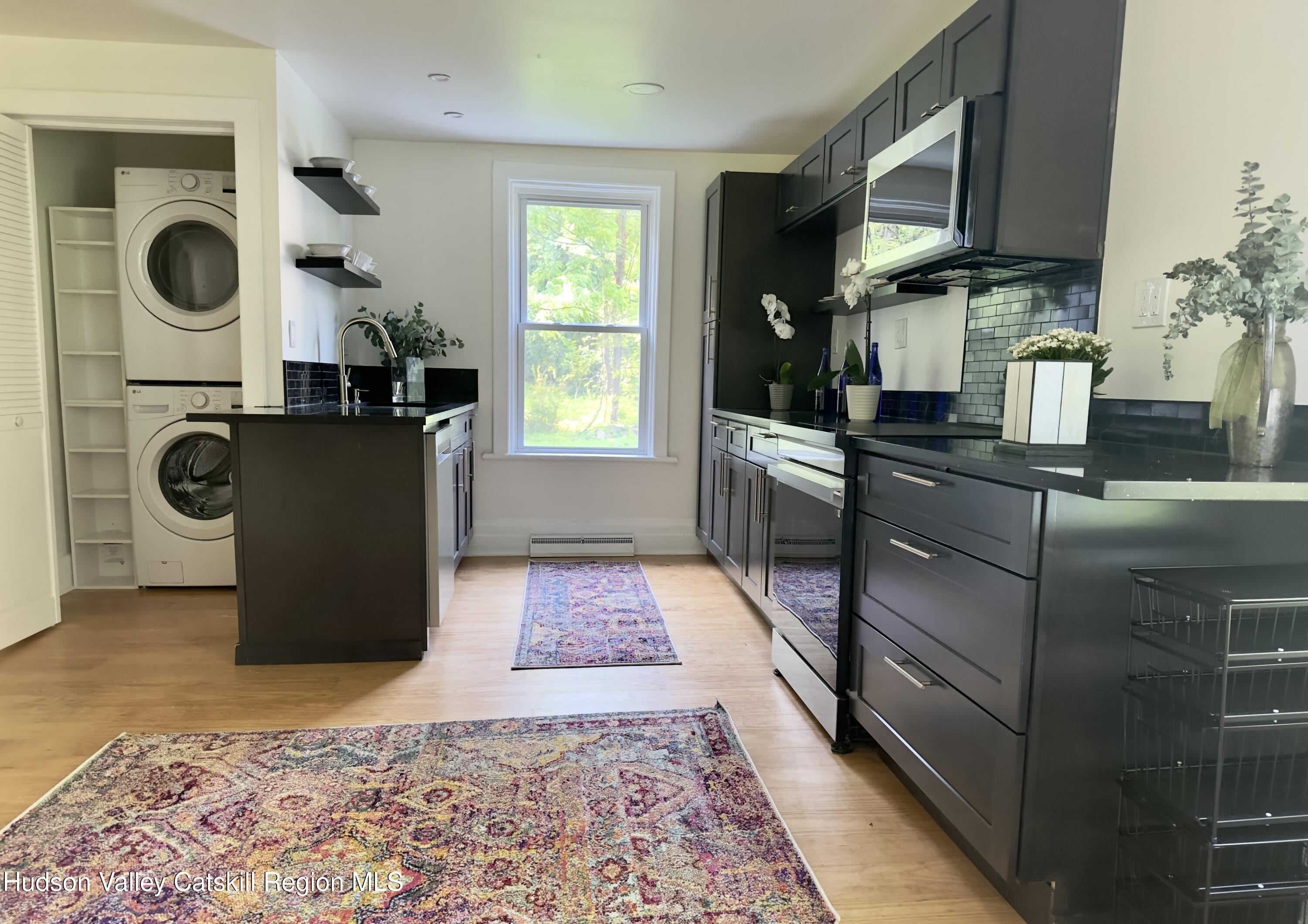 472 Lefever Falls Road Rosendale, NY 12401 - Photo 14 of 50 a kitchen with a refrigerator and a stove top oven