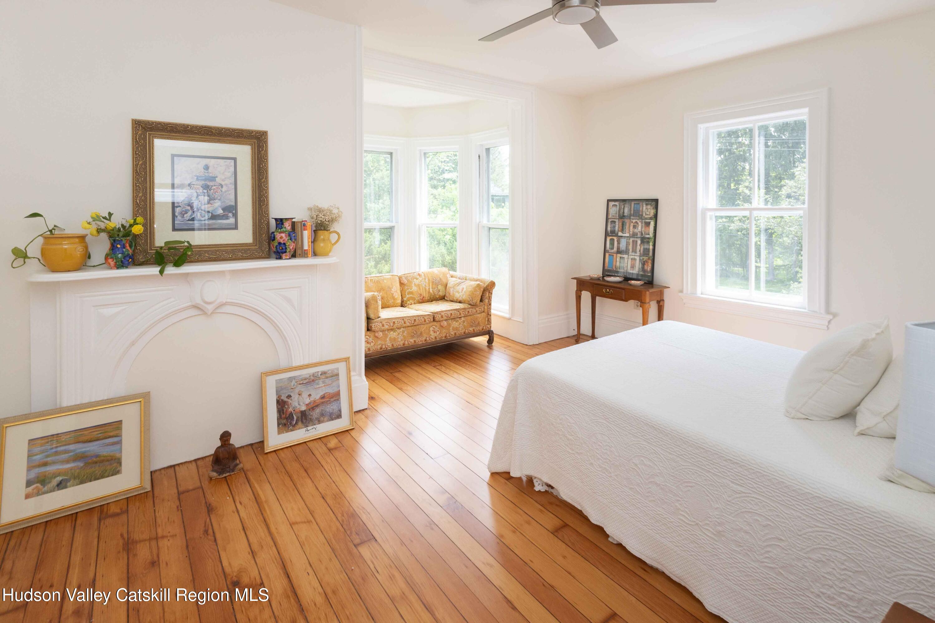 472 Lefever Falls Road Rosendale, NY 12401 - Photo 23 of 50 a bedroom with a bed and wooden floor
