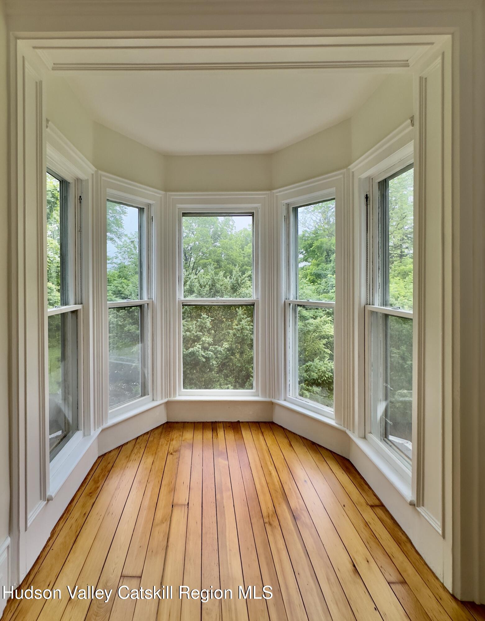 472 Lefever Falls Road Rosendale, NY 12401 - Photo 26 of 50 a view of empty room with wooden floor and fan