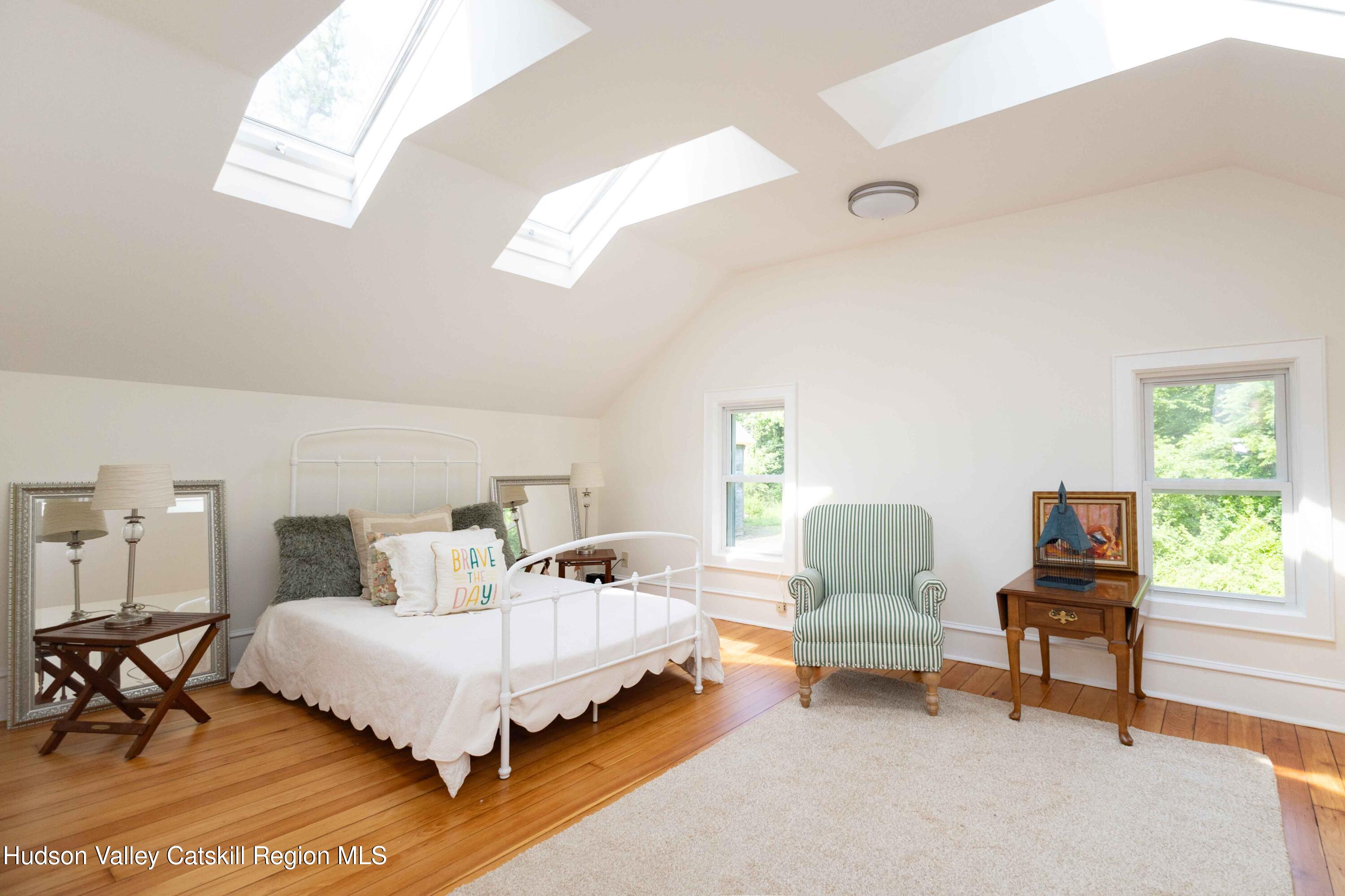 472 Lefever Falls Road Rosendale, NY 12401 - Photo 28 of 50 a bed room with a bed and a chair